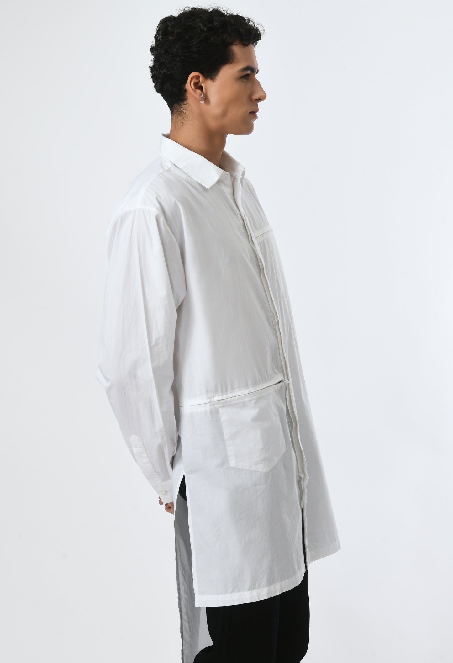 White unisex loose-fit high-low cut shirt.
