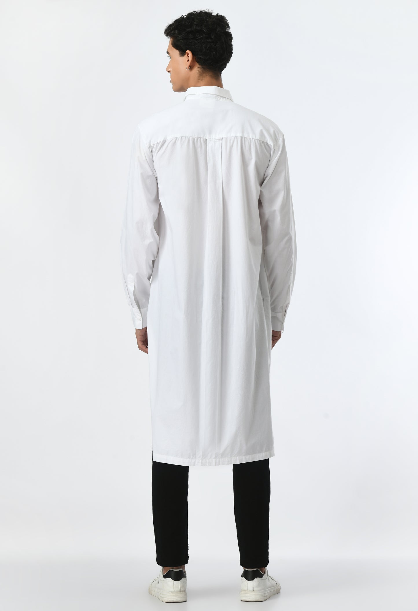 White unisex loose-fit high-low cut shirt.