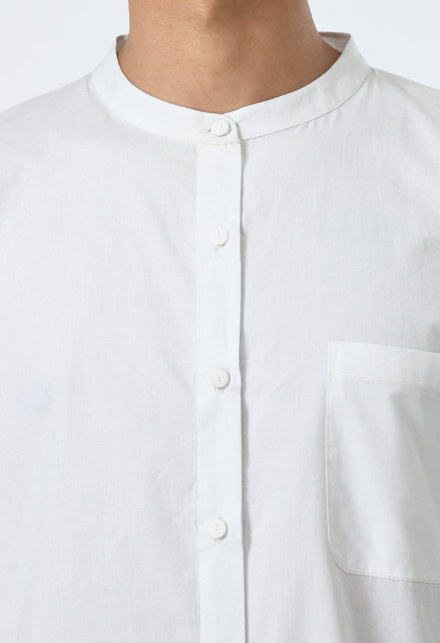 White unisex cotton shirt with Chinese collar.