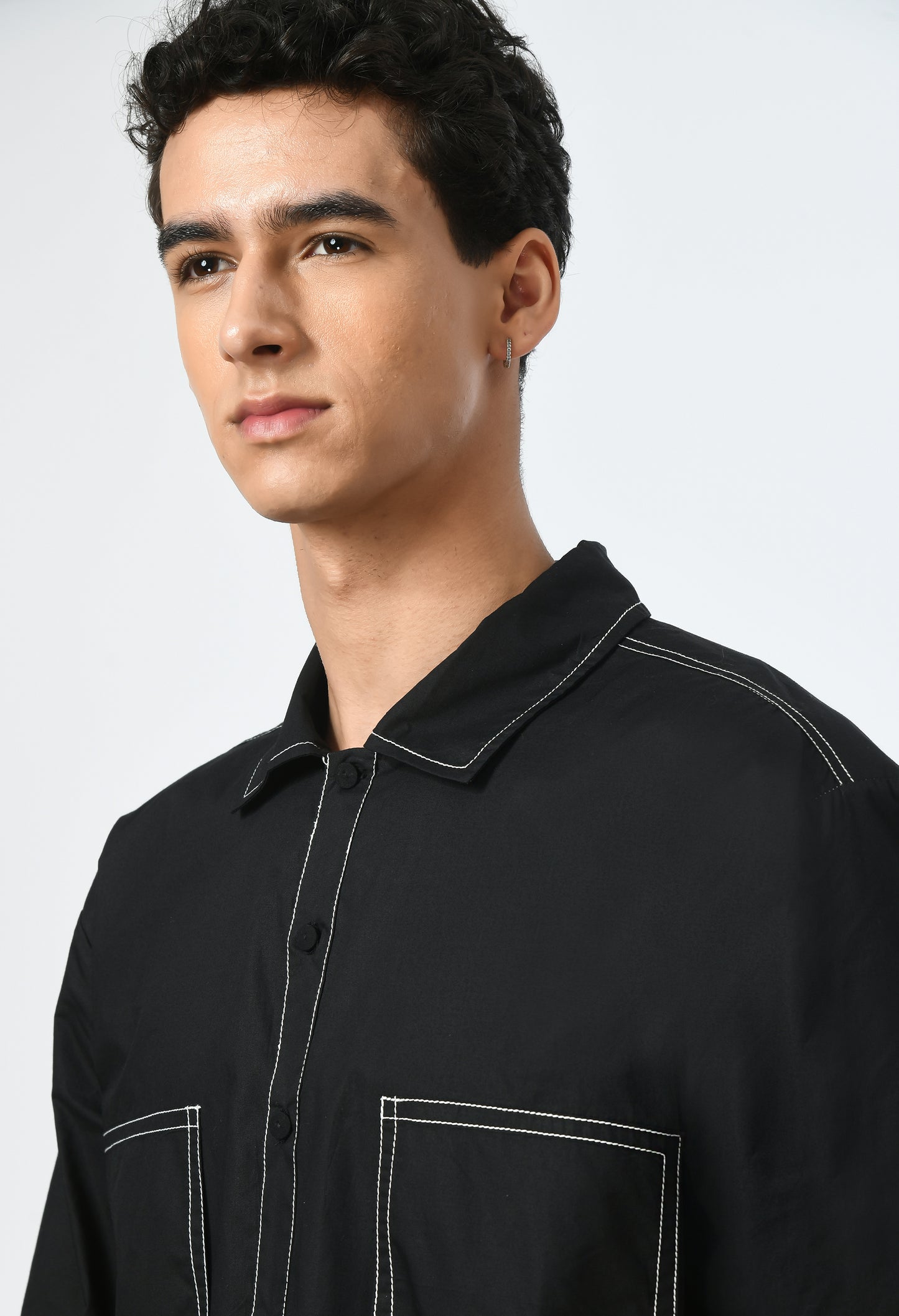 Unisex black shirt with classic collar.