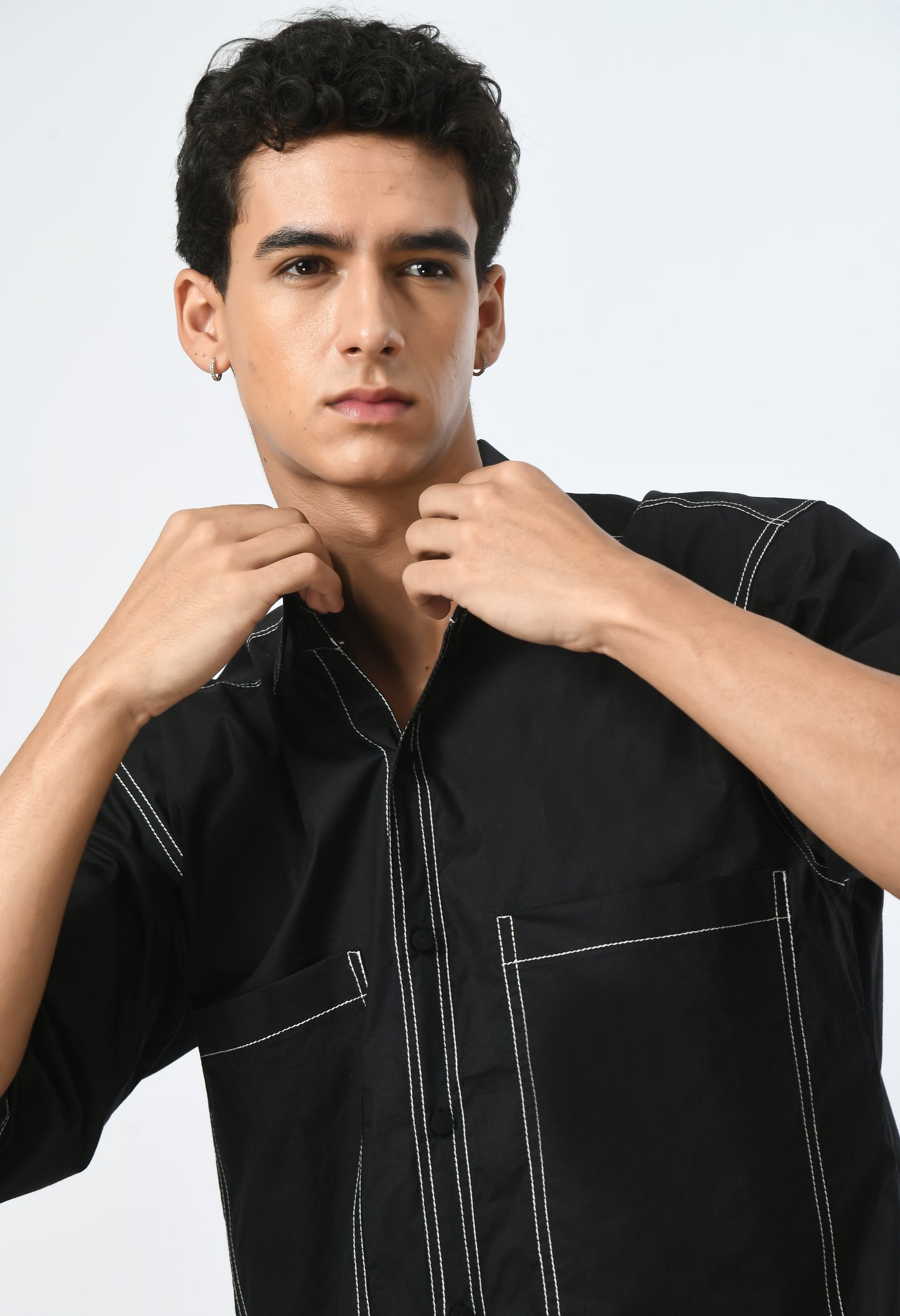 Black unisex shirt with a classic collar.