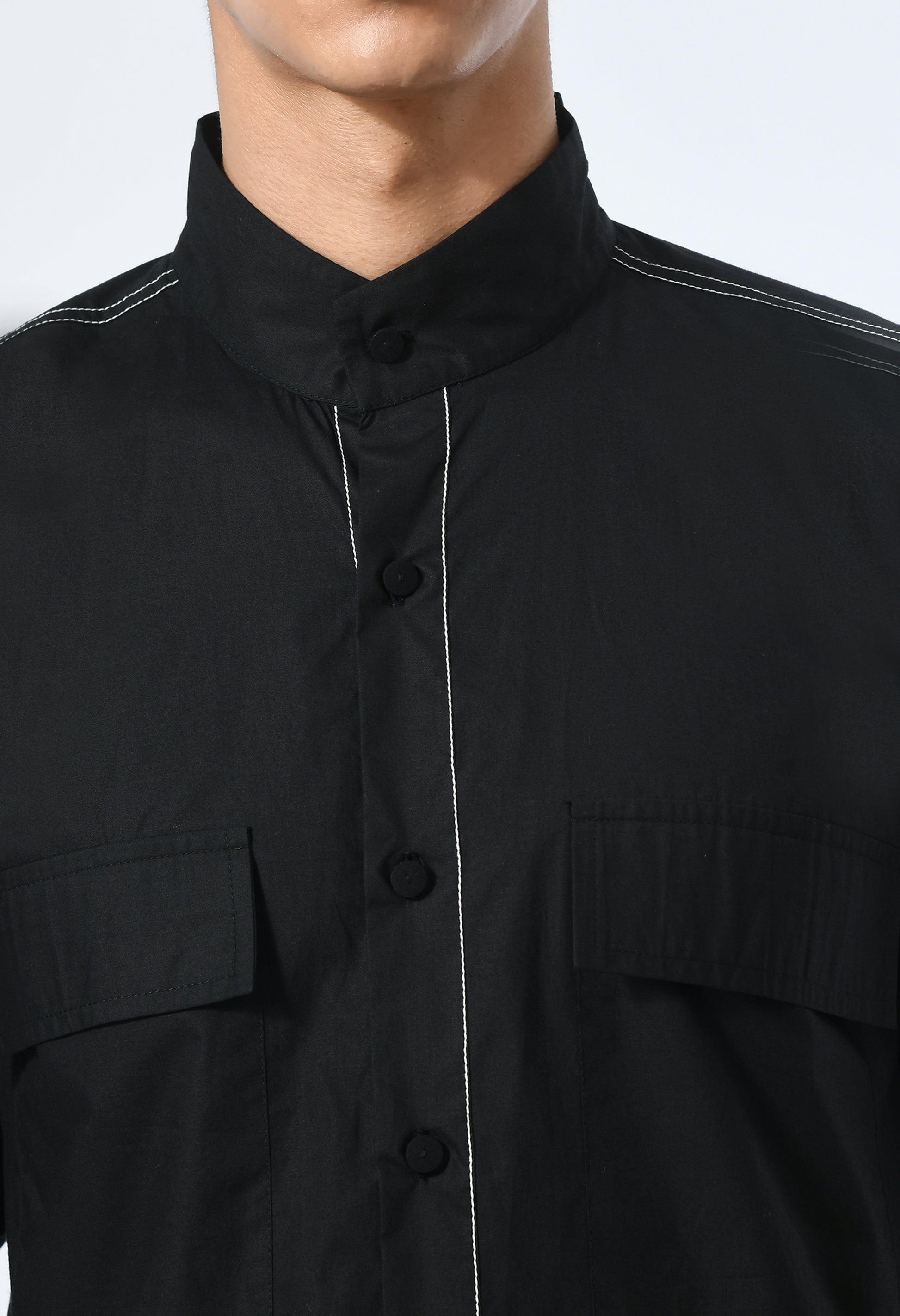 Marked in Black shirt