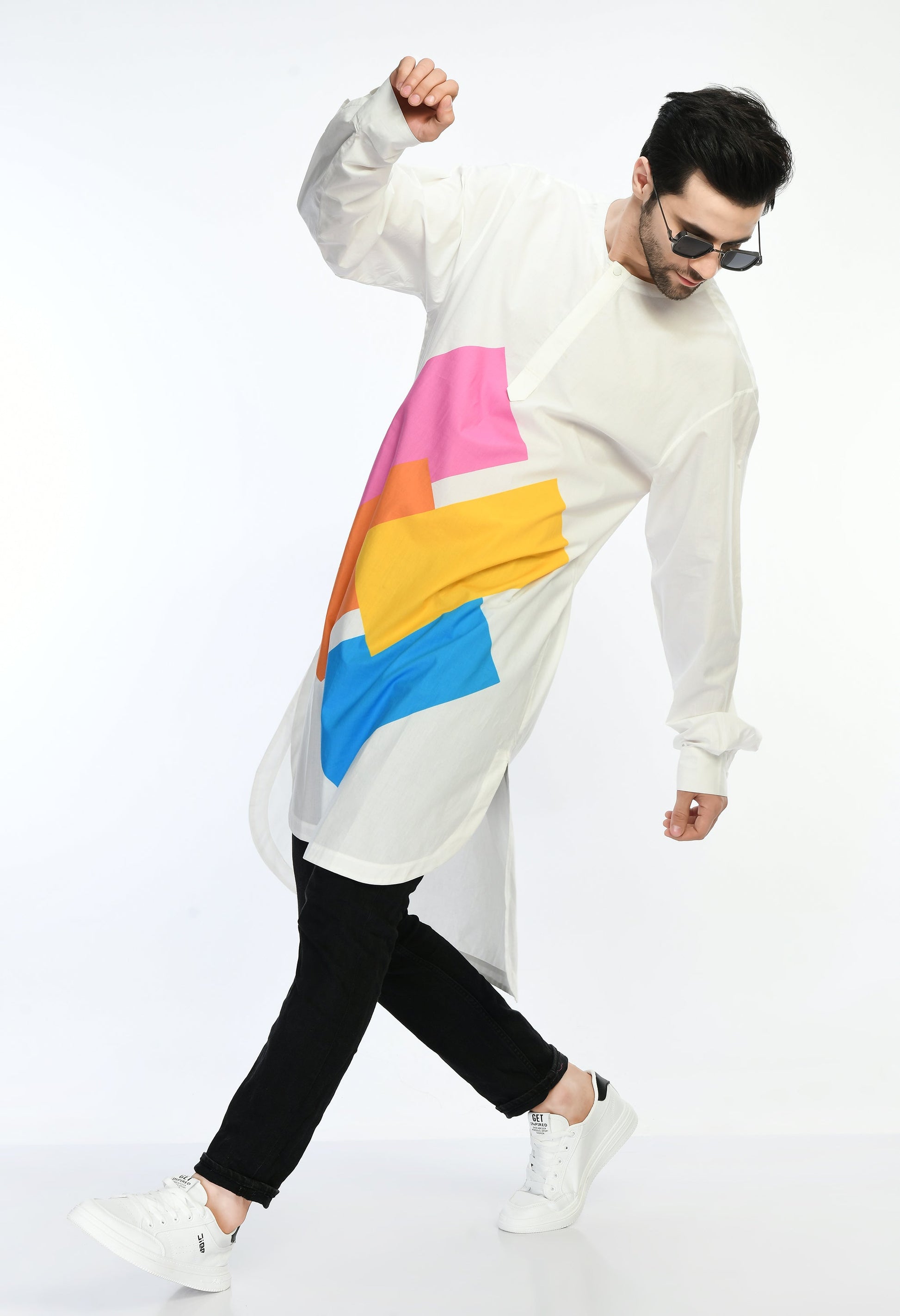 Man wearing a colorful abstract print Color Code Shirt with bold designs.