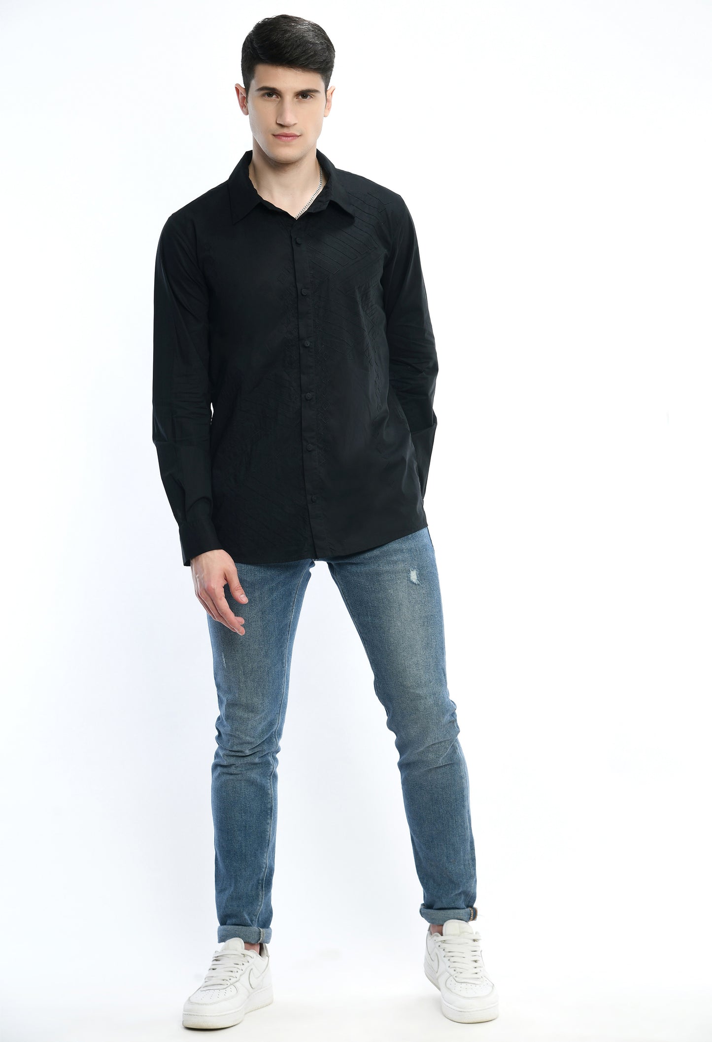 A black cotton shirt showcasing tone on tone appliqué work