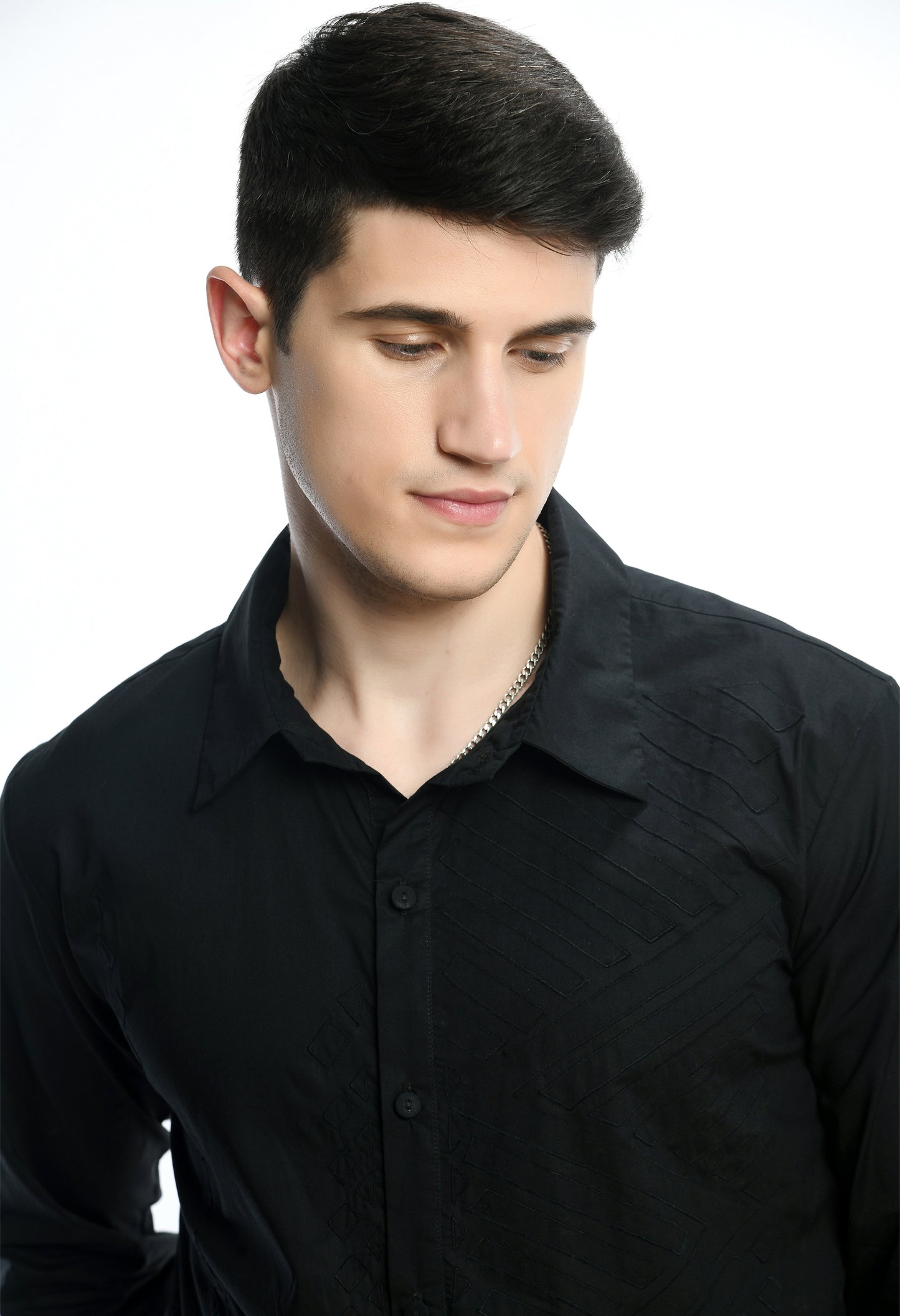 A black cotton shirt showcasing tone on tone appliqué work