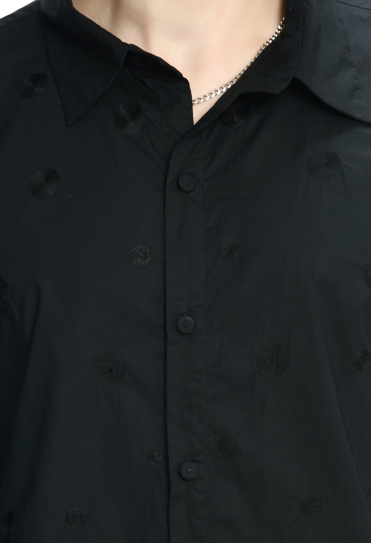 A black cotton shirt showcasing tone on tone thread embroidery