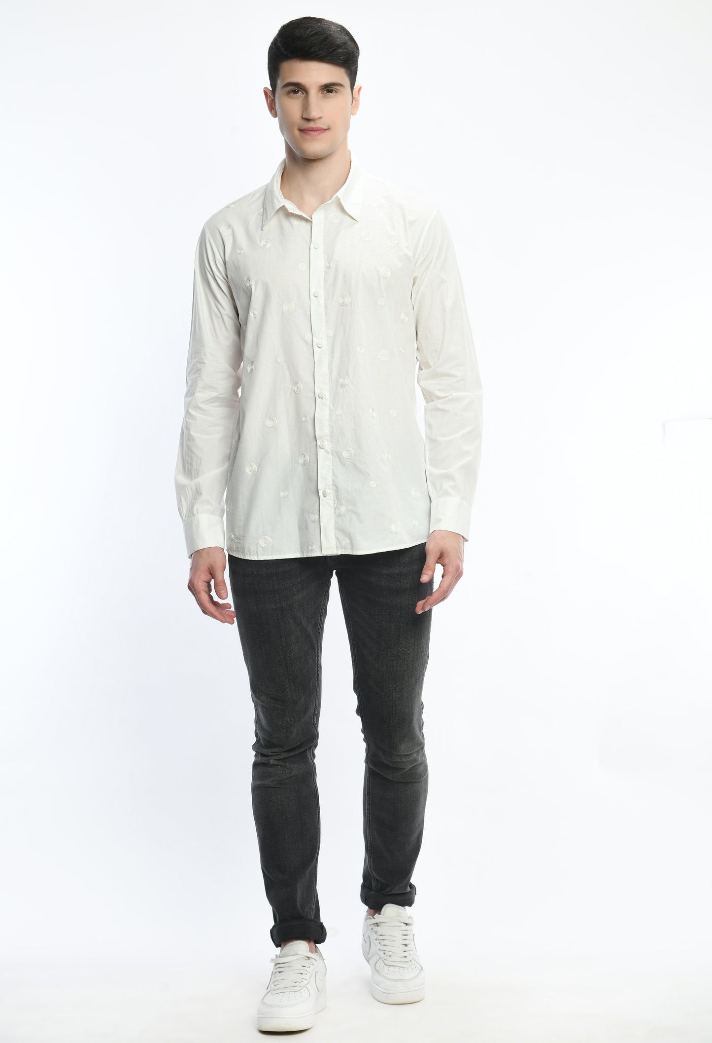 A white cotton shirt showcasing tone on tone thread embroidery