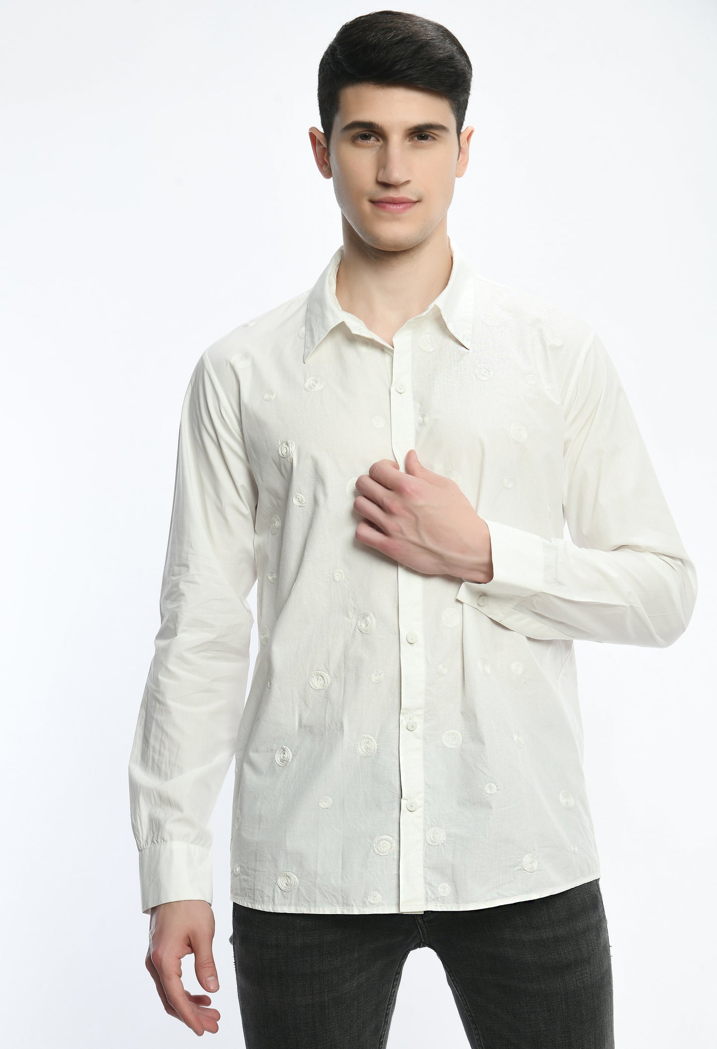 A white cotton shirt showcasing tone on tone thread embroidery