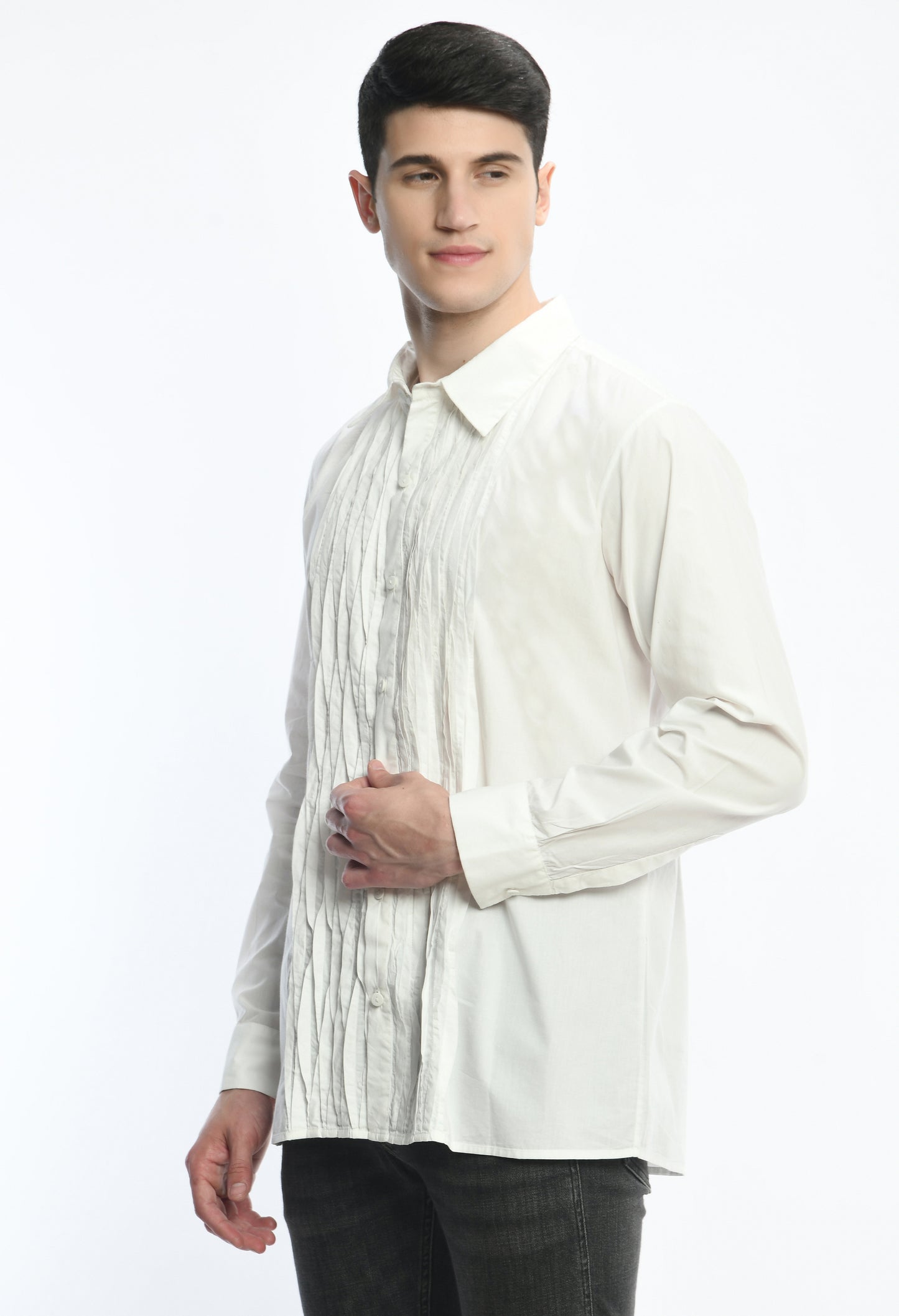 A white cotton shirt showcasing asymmetric pintex in the front