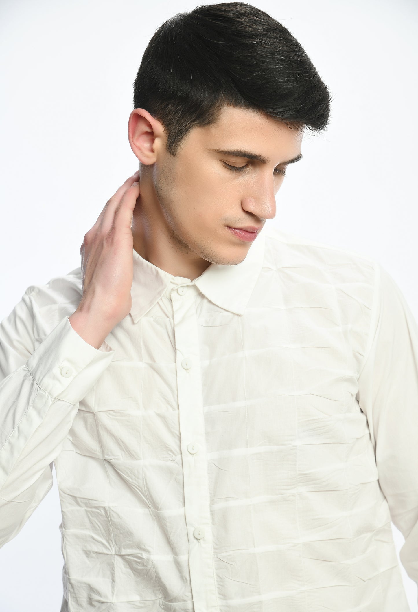 A white cotton shirt showcasing smocking technique