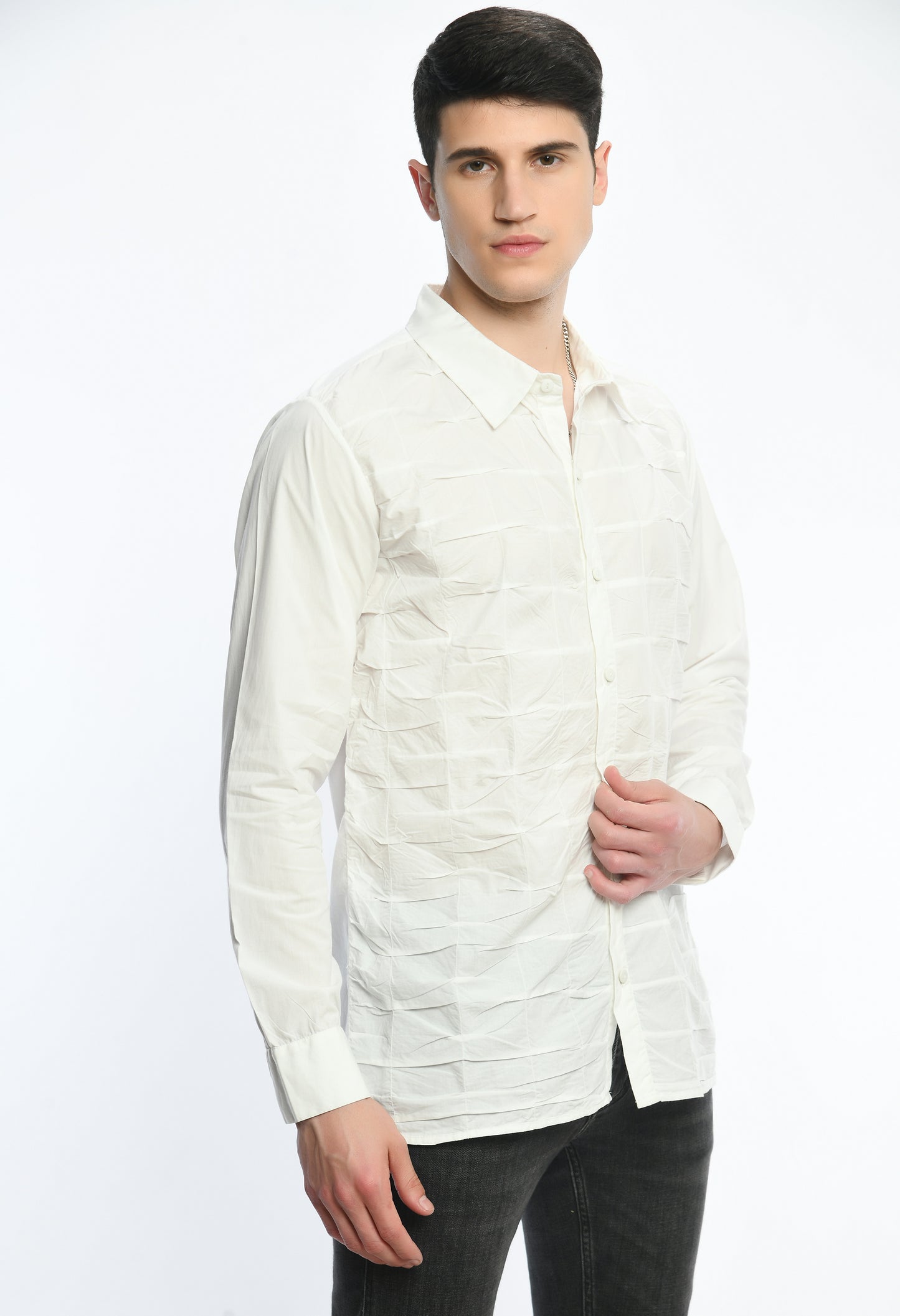 A white cotton shirt showcasing smocking technique