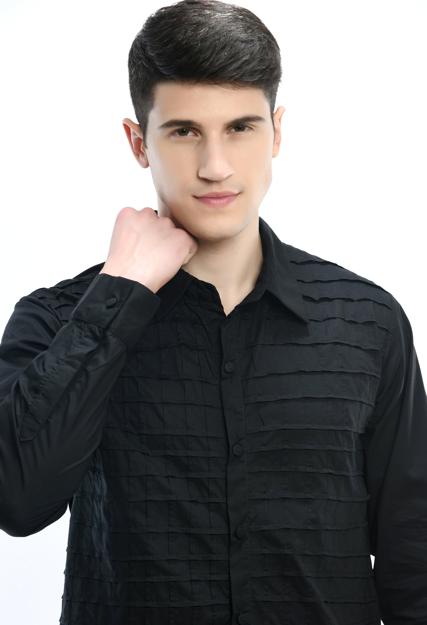 A black cotton shirt showcasing pintex lines creating a tone on tone pattern.