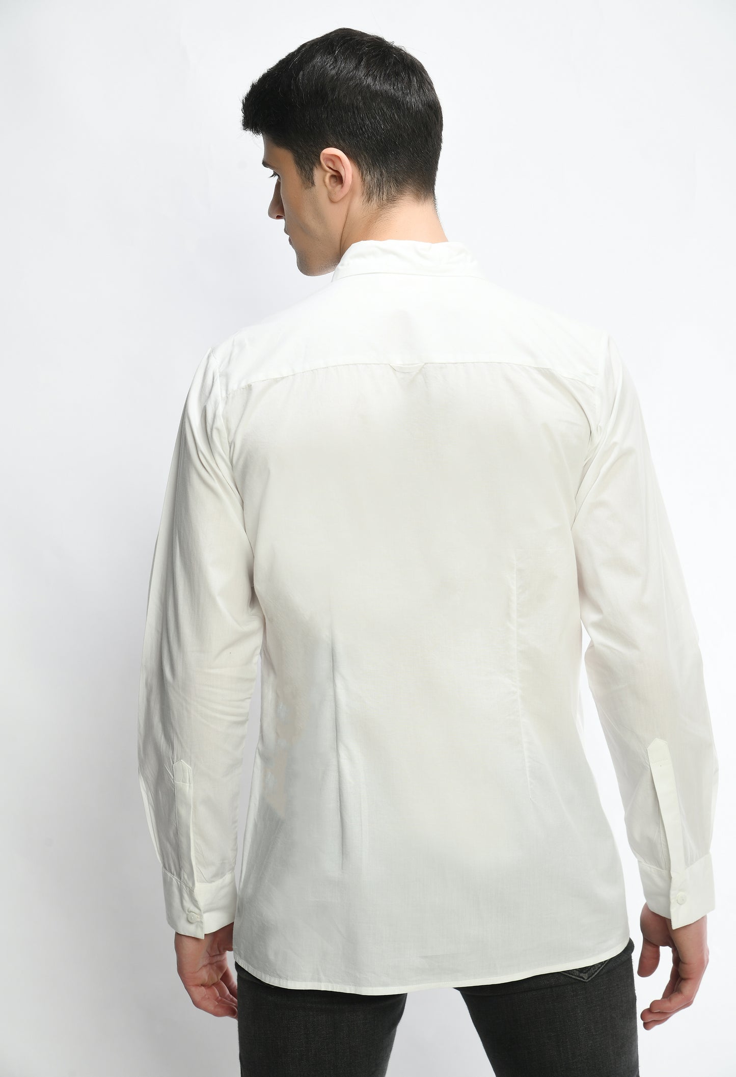 A white cotton shirt showcasing pintex lines in the front in diagonal pattern.