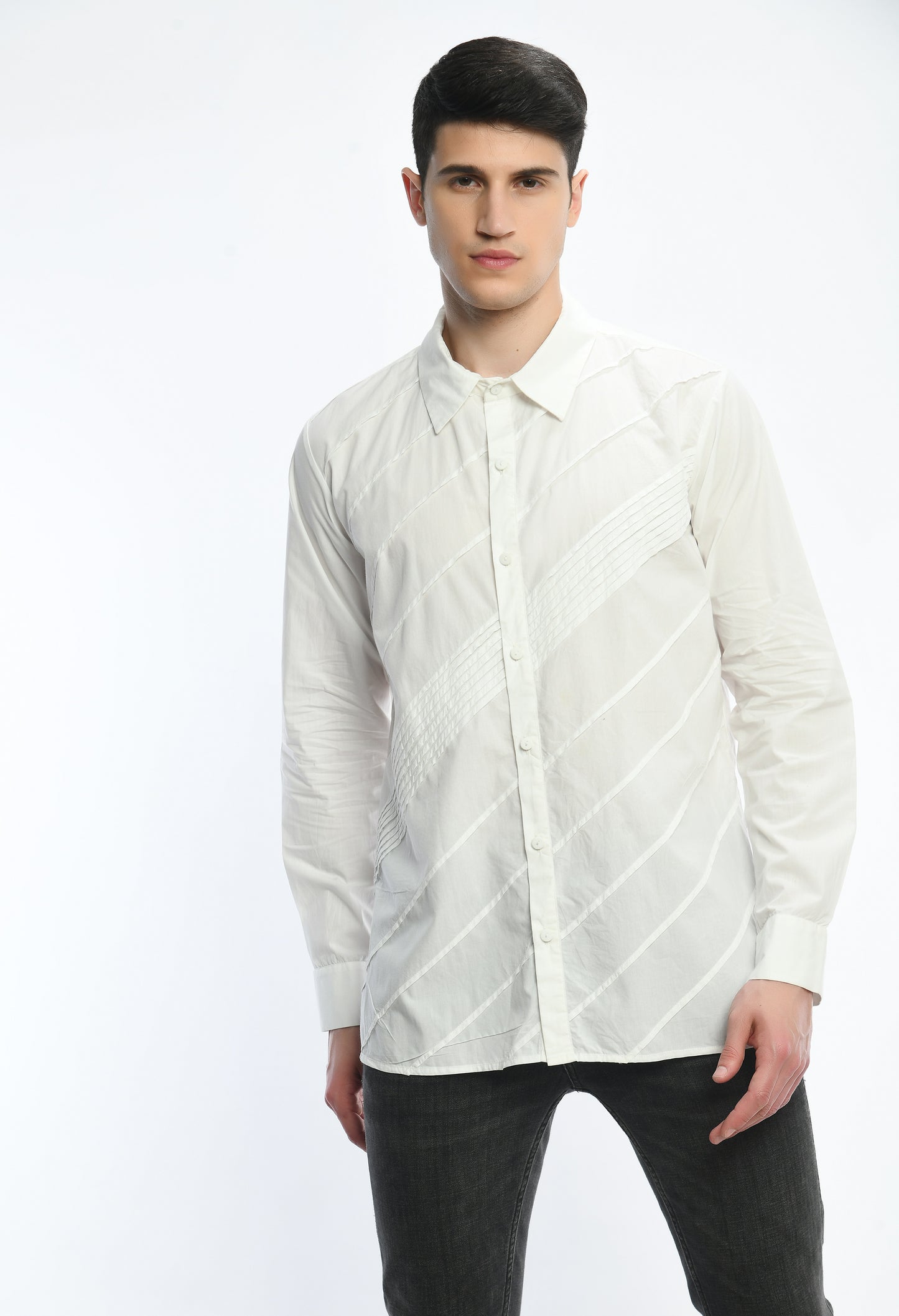 A white cotton shirt showcasing pintex lines in the front in diagonal pattern.