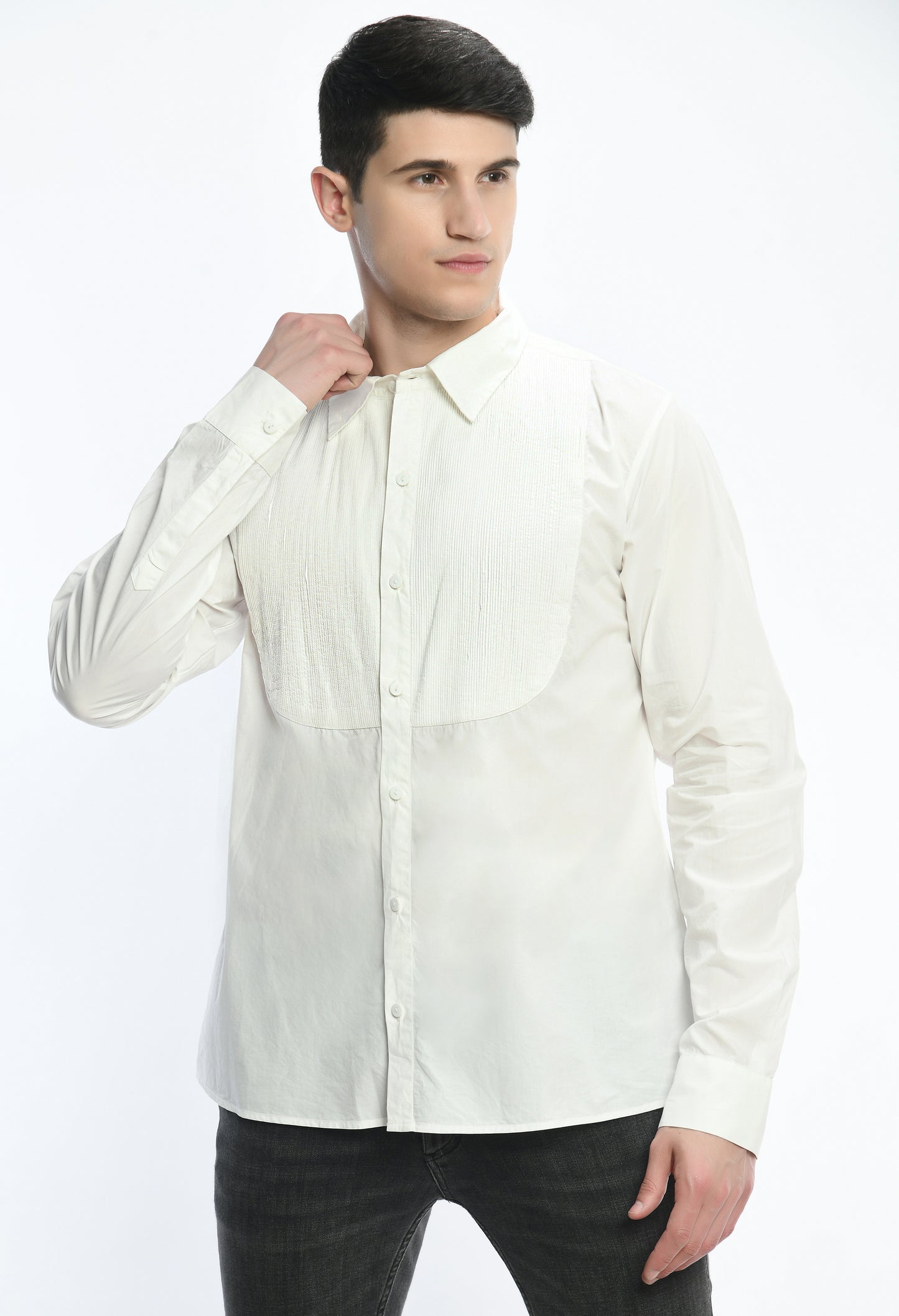 A white cotton shirt showcasing pintex around the neck.