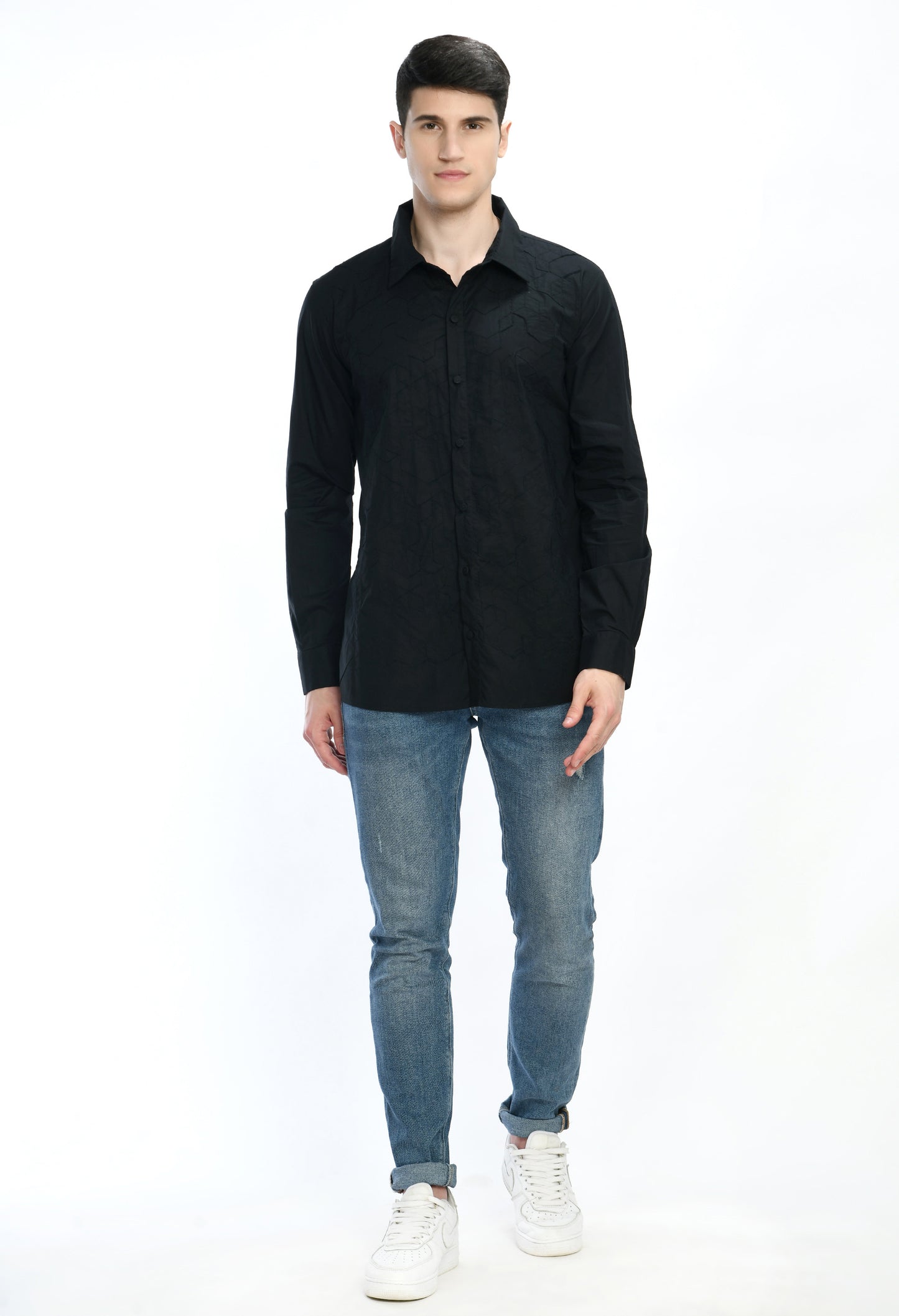 A black cotton shirt showcasing tone on tone appliqué work.