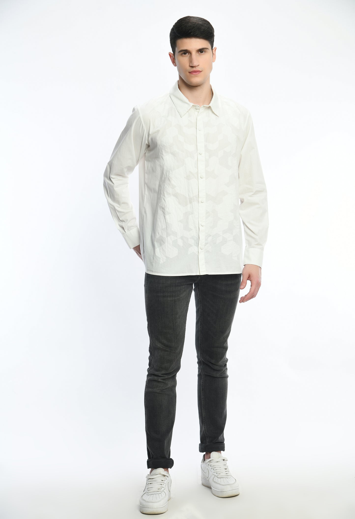 A white cotton shirt showcasing tone on tone appliqué work.