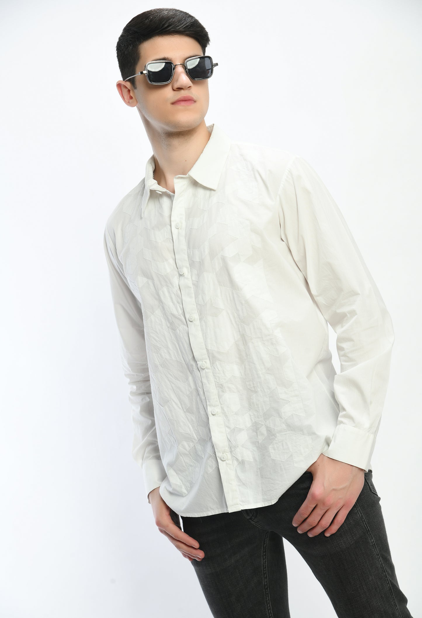 A white cotton shirt showcasing tone on tone appliqué work.