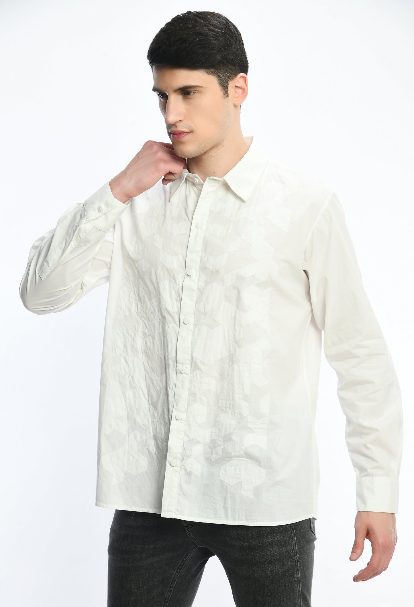 A white cotton shirt showcasing tone on tone appliqué work.