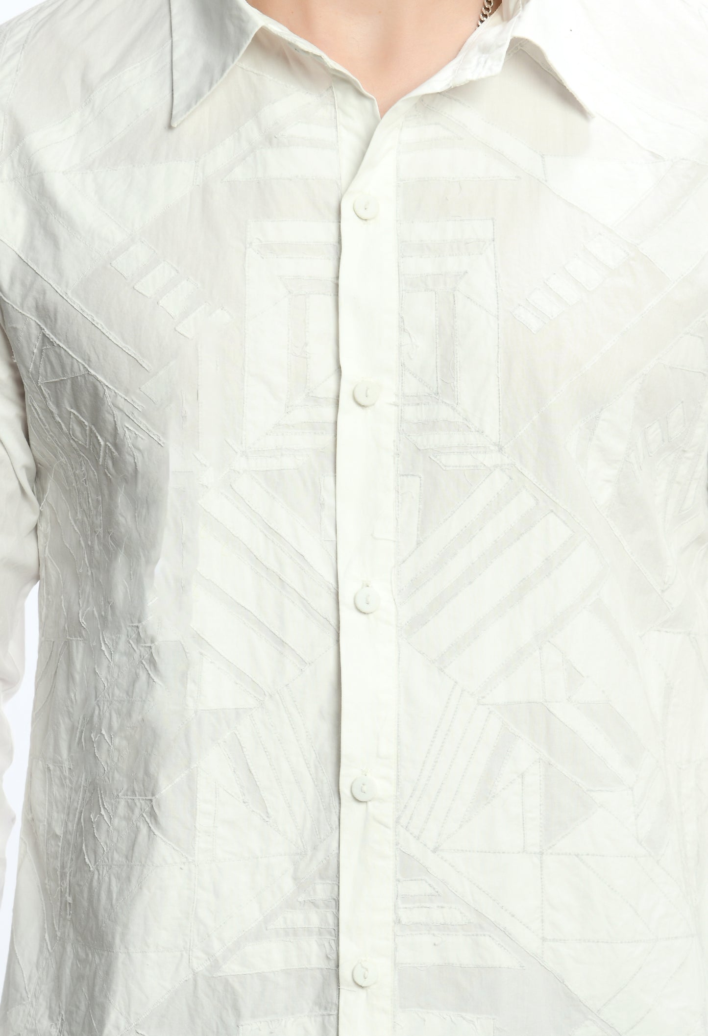 A White cotton shirt showcasing tone on tone appliqué work