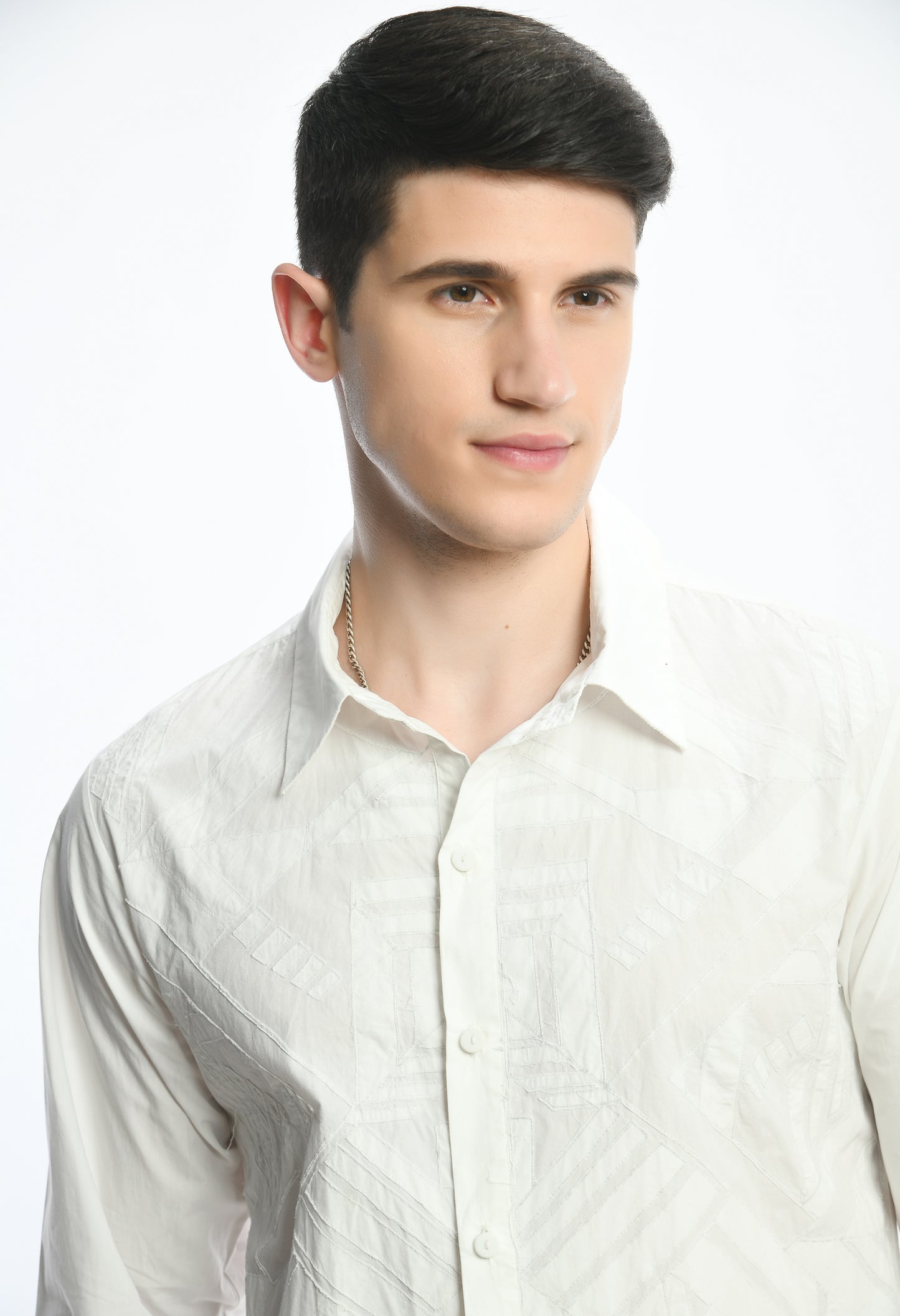 A White cotton shirt showcasing tone on tone appliqué work