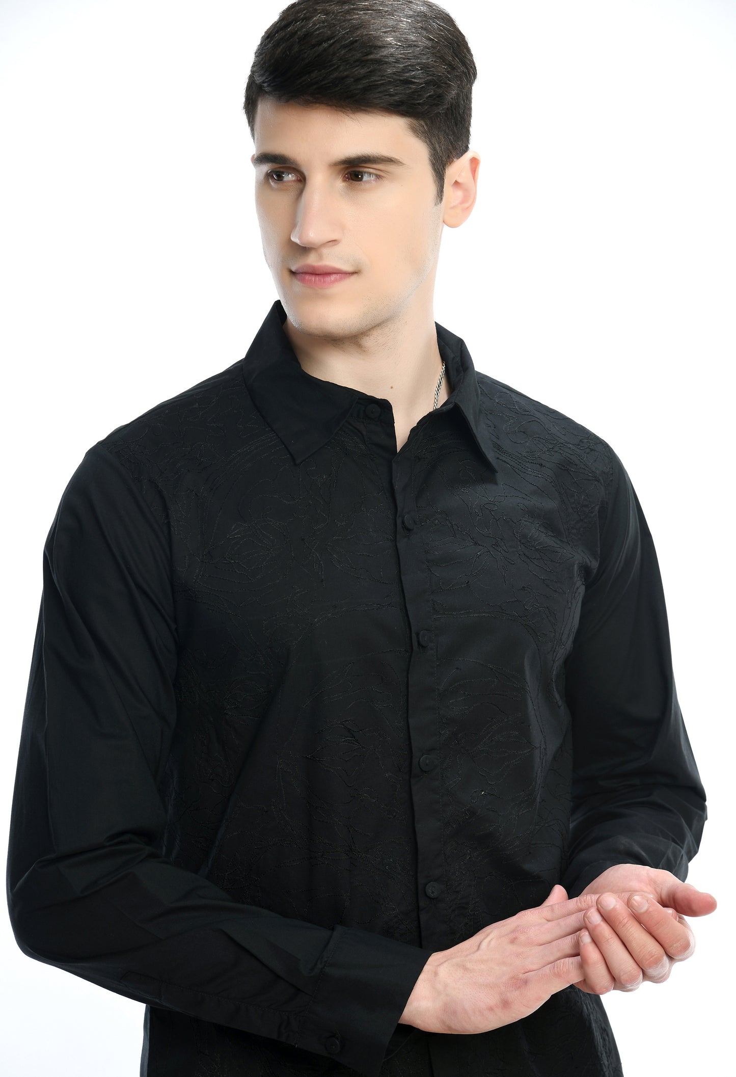 A black cotton shirt showcasing tone on tone abstract thread embroidery