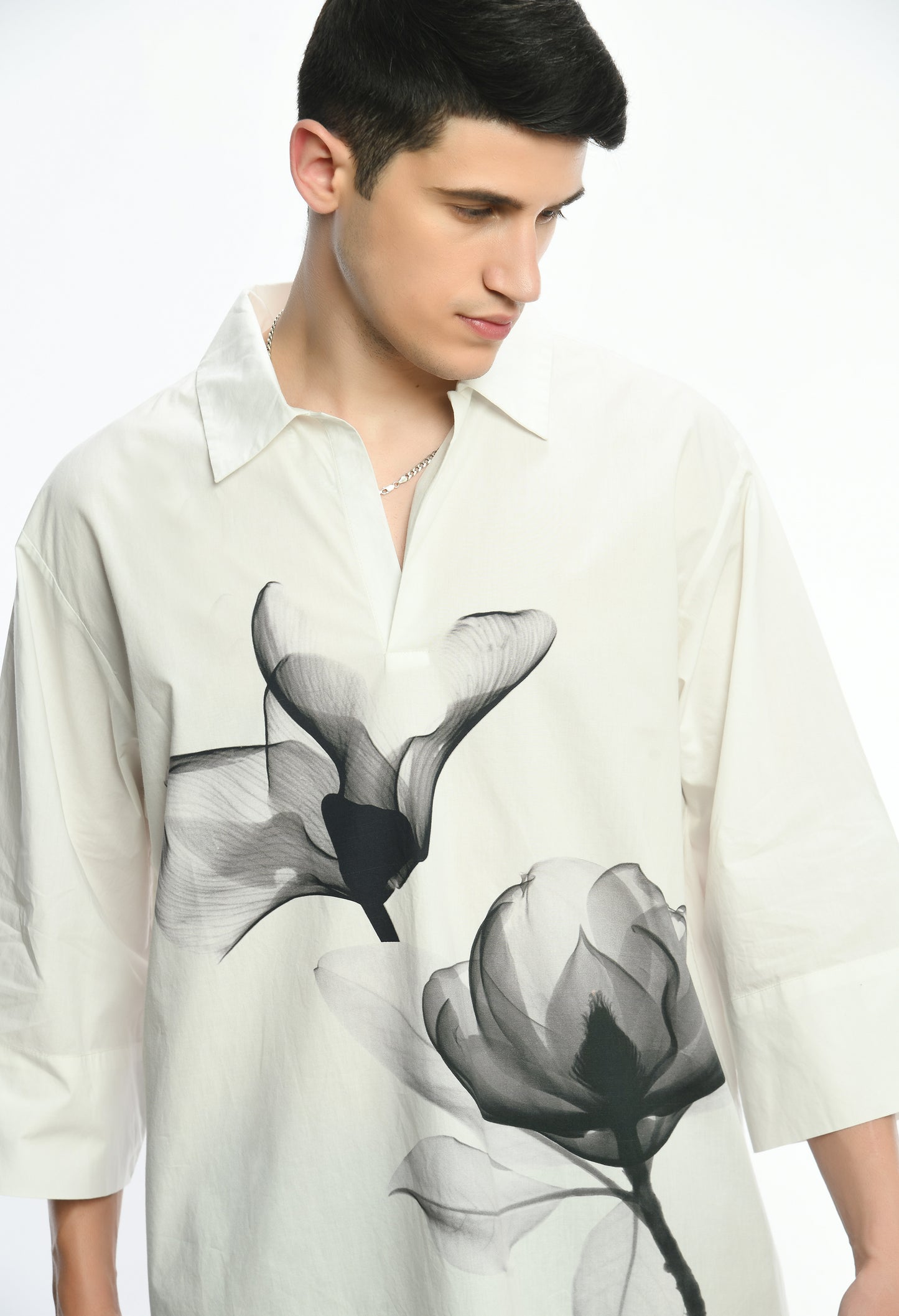 White, stylish, lose-fit, cotton shirt with digital print on it.