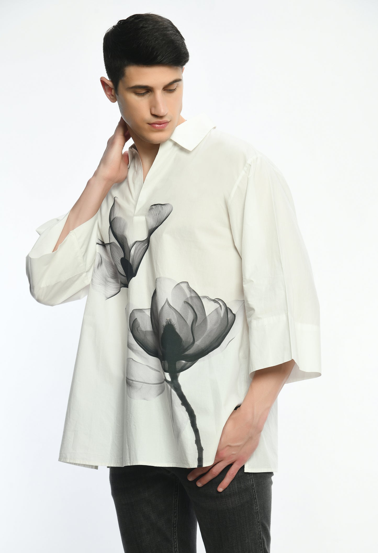 White, stylish, lose-fit, cotton shirt with digital print on it.